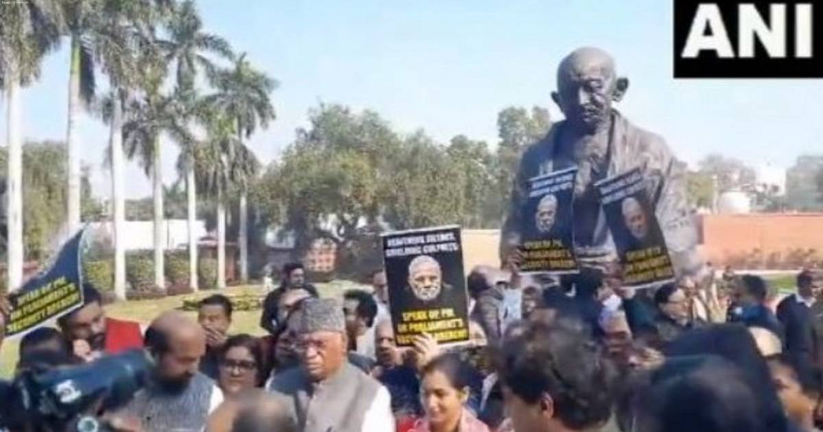 Opposition protests suspension of 92 MPs infront of Gandhi Statue in Parliament premises